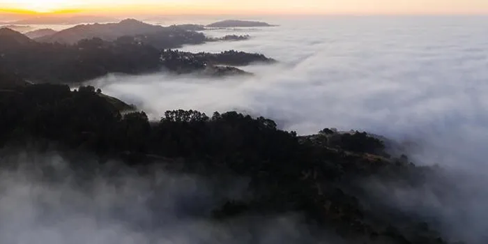 Framed Print : The marine layer, a moist air mass developing over the Pacific in the presence of a temperature inversion, seeps over the San Francisco Bay Area Framed Print : The marine layer, a moist air mass developing over the Pacific in the presence of a temperature inversion, seeps over the San Francisco Bay Area