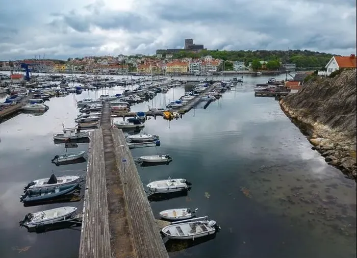 Framed Print : Marstrand, Sweden - May 22, 2023: The port and a view at the castle of a small island and town of Marstrand