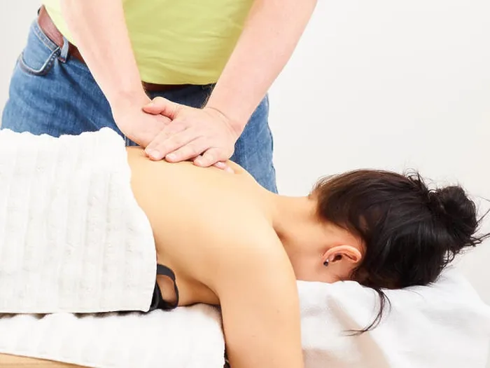 Framed Print : Massage, professional masseur and a woman customer