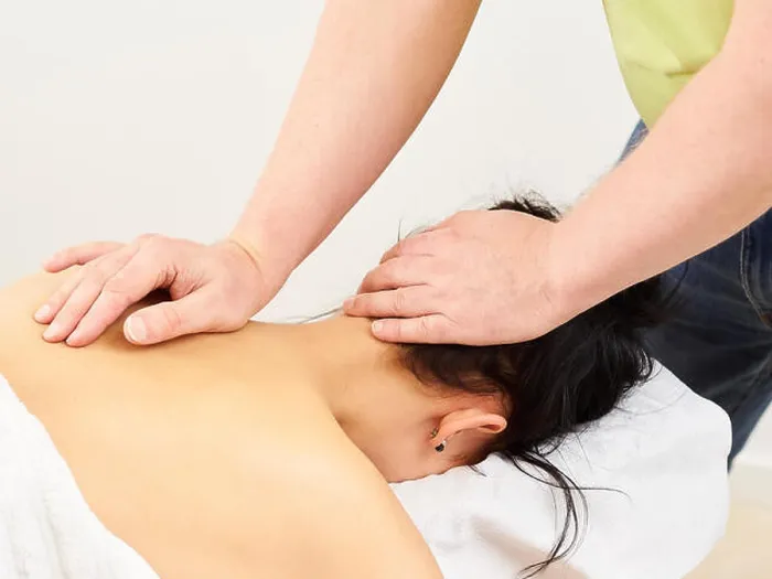 Framed Print : Massage, professional masseur and a woman customer Framed Print : Massage, professional masseur and a woman customer