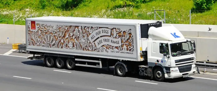 Framed Print : McDonalds advert for free range eggs on store supply chain delivery trailer behind lorry truck driving along UK m25 Framed Print : McDonalds advert for free range eggs on store supply chain delivery trailer behind lorry truck driving along UK m25