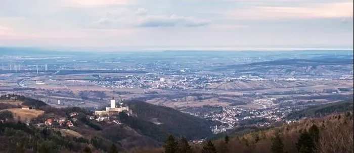 Framed Print : The medieval Forchtenstein Castle on the hilltop surrounded by dense forest below and view up to lake neusiedlersee