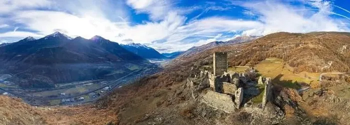 Framed Print : Medieval impressive castle Cly surrouded by Alps mountains in Valle d'aosta, Italy. aerial drone panoramic view Framed Print : Medieval impressive castle Cly surrouded by Alps mountains in Valle d'aosta, Italy. aerial drone panoramic view