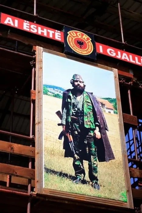 Framed Print : In the memorial place in Prekaz in front of the picture of freedom fighter Adem Jashari Framed Print : In the memorial place in Prekaz in front of the picture of freedom fighter Adem Jashari