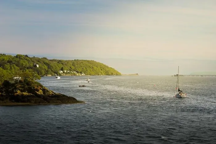 Framed Print : Menai Strait, Anglesey, boats and green hills covered in trees and a beautiful view with calm water Framed Print : Menai Strait, Anglesey, boats and green hills covered in trees and a beautiful view with calm water