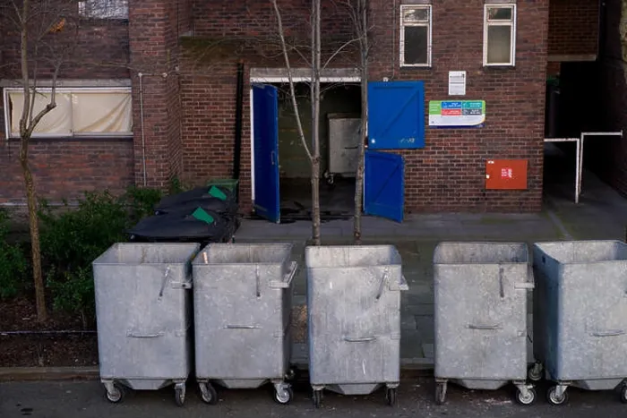 Framed Print : Metal rubbish bins on wheels, housing estate, London Framed Print : Metal rubbish bins on wheels, housing estate, London