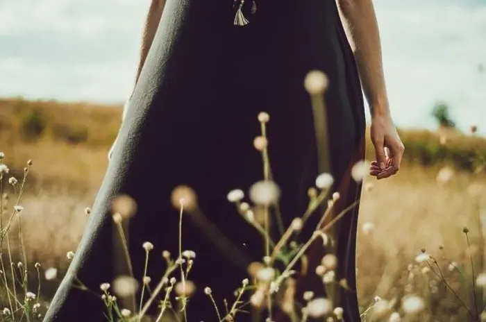Framed Print : Mid section portrait boho style dress young woman standing in the grass and wildflowers connecting with nature Framed Print : Mid section portrait boho style dress young woman standing in the grass and wildflowers connecting with nature