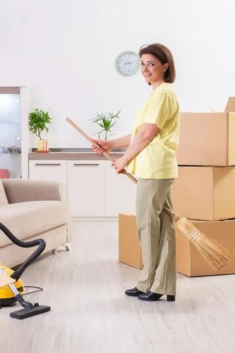 Framed Print : Middle-aged woman cleaning new apartment Framed Print : Middle-aged woman cleaning new apartment