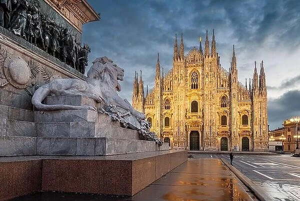 Milan, Italy at the Milan Duomo and Statua di Vittorio Emanuele II at twilight