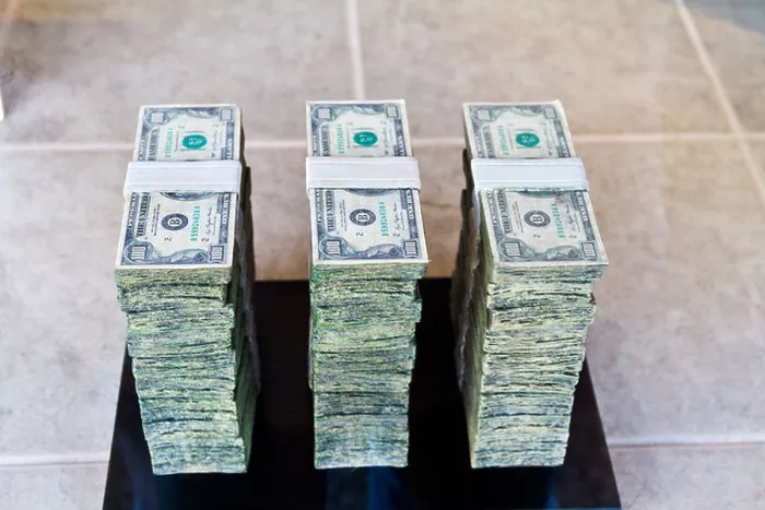Framed Print : One Million dollars in stacked $100 bills Framed Print : One Million dollars in stacked $100 bills