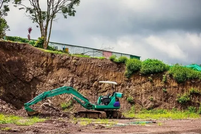Framed Print : Mini excavator is on the ground at site construction Framed Print : Mini excavator is on the ground at site construction