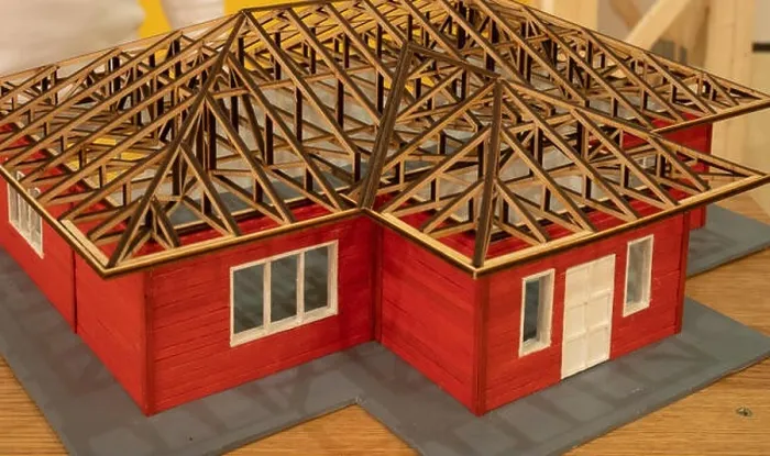 Framed Print : miniature architecture project model of small house made of wood represent actual stage of progress on construction site Framed Print : miniature architecture project model of small house made of wood represent actual stage of progress on construction site