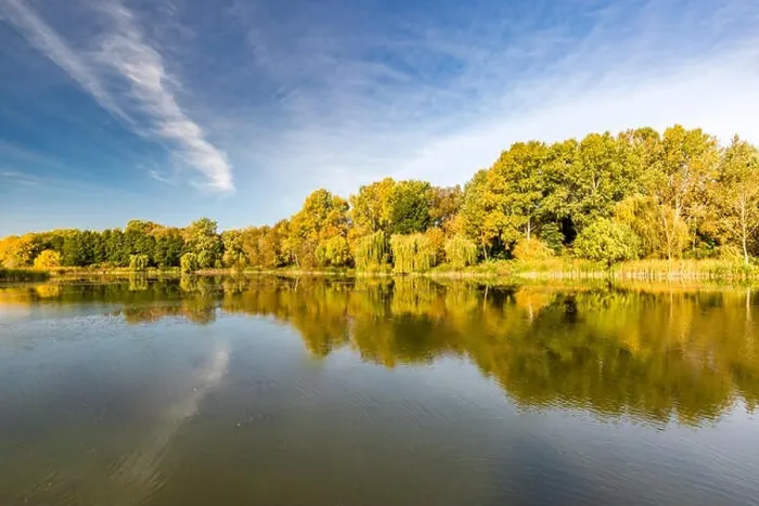 Framed Print : Mirror lagoon rounded by mountains, beautiful autumn lake reflection, colorful tree leaves Framed Print : Mirror lagoon rounded by mountains, beautiful autumn lake reflection, colorful tree leaves