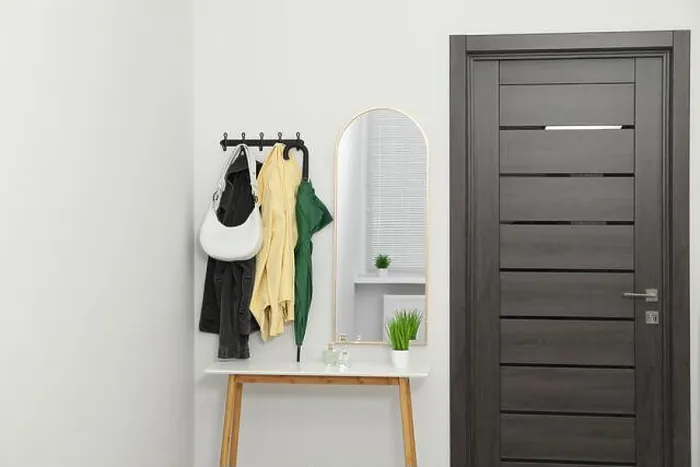 Framed Print : Mirror, rack with clothes and shoe storage bench in hallway. Interior design Framed Print : Mirror, rack with clothes and shoe storage bench in hallway. Interior design