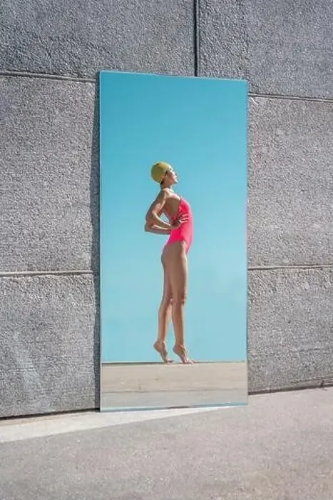 Framed Print : Mirror reflection of woman standing with hands on hips during sunny day Framed Print : Mirror reflection of woman standing with hands on hips during sunny day