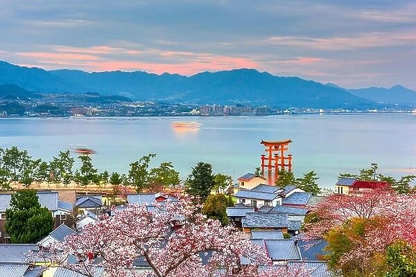 Miyajima Island, Hiroshima, Japan with temples on the Seto Inland Sea at dusk in the spring season