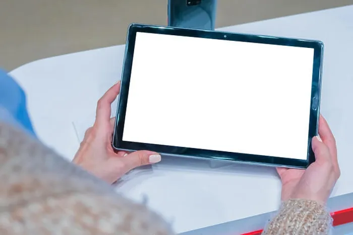 Framed Print : Mock up: woman looking at smartphone with blank white screen at store, shop Framed Print : Mock up: woman looking at smartphone with blank white screen at store, shop