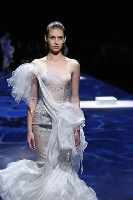 Framed Print : A model displays a new creation by Lan Yu at its Fall / Winter 2014 Haute Couture fashion show in Paris Framed Print : A model displays a new creation by Lan Yu at its Fall / Winter 2014 Haute Couture fashion show in Paris