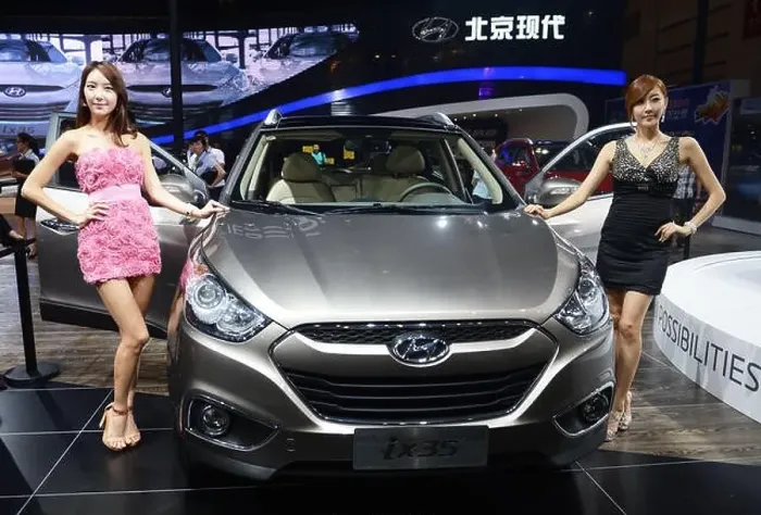 Framed Print : Models pose with a Hyundai ix35 during the 15th Chengdu Motor Show 2012 in Chengdu city Framed Print : Models pose with a Hyundai ix35 during the 15th Chengdu Motor Show 2012 in Chengdu city
