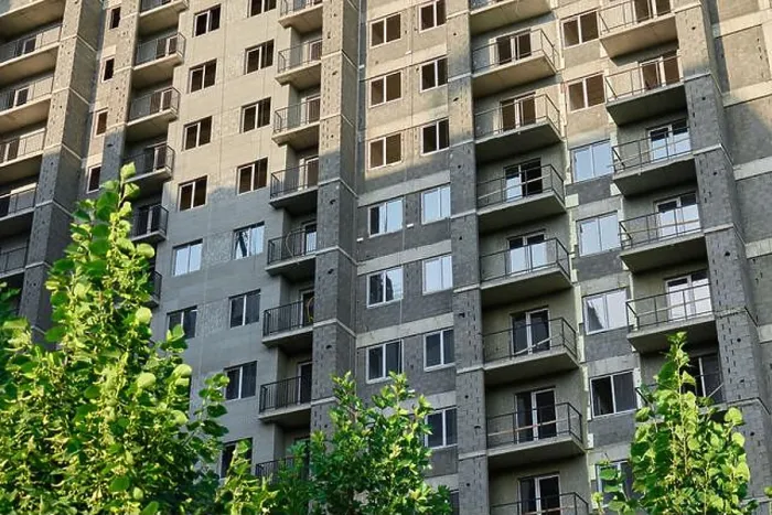 Framed Print : Modern apartment building with greenery in urban environment during daylight Framed Print : Modern apartment building with greenery in urban environment during daylight