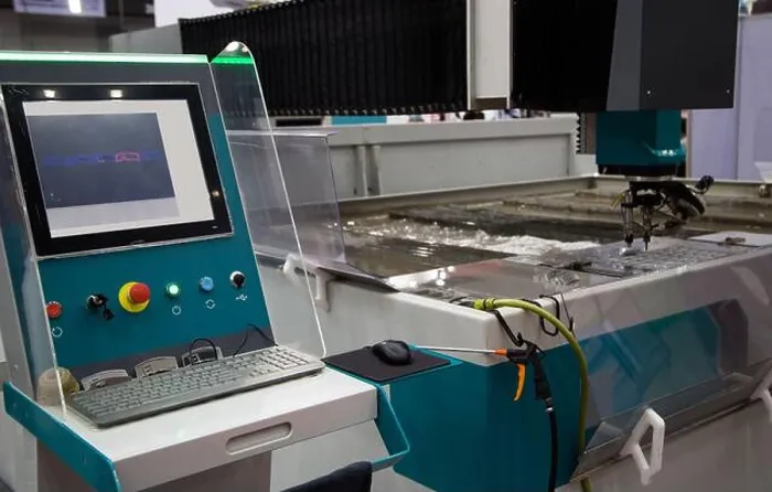 Framed Print : Modern CNC Abrasive water jet cutting machine using high pressure water jet to cut metal Framed Print : Modern CNC Abrasive water jet cutting machine using high pressure water jet to cut metal