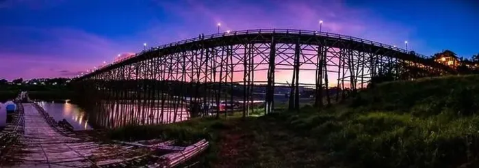 Framed Print : Mon Bridge, old wooden bridge at sunset in Sangkhlaburi, Kanchanaburi, Thailand, south east asia Framed Print : Mon Bridge, old wooden bridge at sunset in Sangkhlaburi, Kanchanaburi, Thailand, south east asia