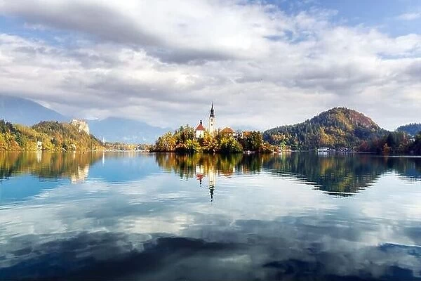 Morning autumn view of Bled lake in Julian Alps, Slovenia. Pilgrimage church of the Assumption of Maria on a foreground. Landscape photography