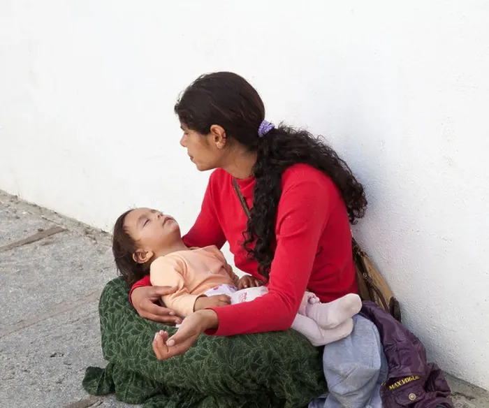 Framed Print : Mother begging with child