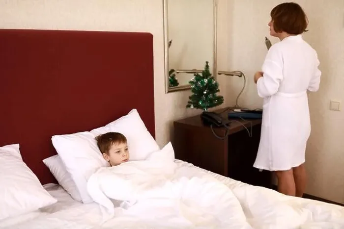 Framed Print : Mother with son in hotel room in morning Framed Print : Mother with son in hotel room in morning