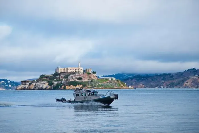 Framed Print : Motor boat in front of Alcatraz in San Francisco Framed Print : Motor boat in front of Alcatraz in San Francisco
