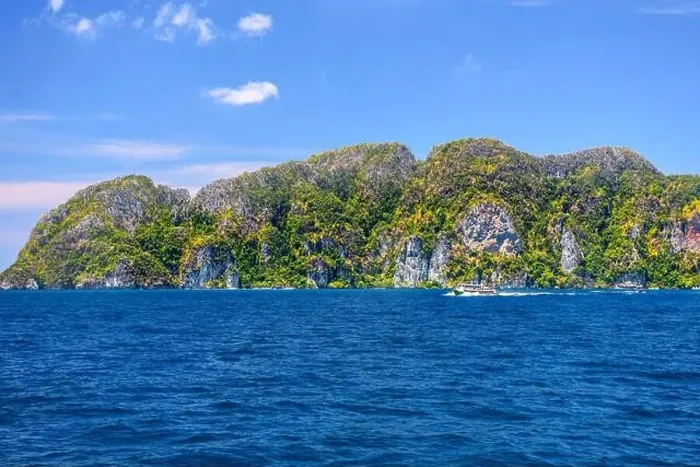 Framed Print : Motor ship in the bay of Ko Phi Phi Don Island with huge rocks and cliffs on a sunny day Framed Print : Motor ship in the bay of Ko Phi Phi Don Island with huge rocks and cliffs on a sunny day