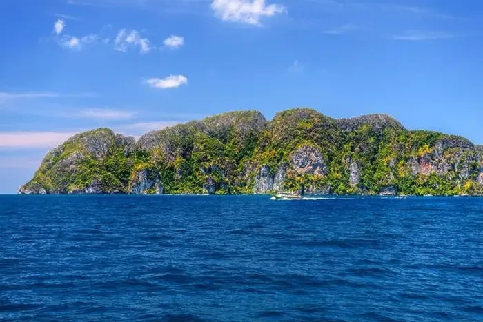 Framed Print : Motor ship in the bay of Ko Phi Phi Don Island with huge rocks and cliffs on a sunny day Framed Print : Motor ship in the bay of Ko Phi Phi Don Island with huge rocks and cliffs on a sunny day