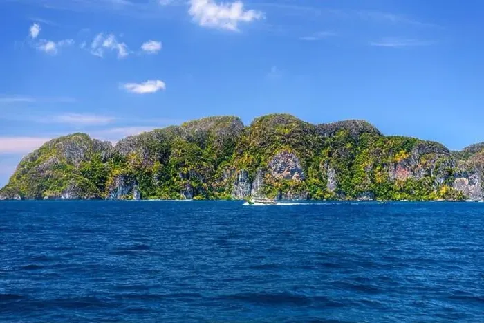 Framed Print : Motor ship in the bay of Ko Phi Phi Don Island with huge rocks and cliffs on a sunny day Framed Print : Motor ship in the bay of Ko Phi Phi Don Island with huge rocks and cliffs on a sunny day