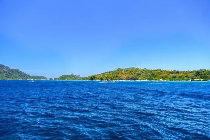 Framed Print : Motor ship in the bay of Ko Phi Phi Don Island with huge rocks and cliffs on a sunny day Framed Print : Motor ship in the bay of Ko Phi Phi Don Island with huge rocks and cliffs on a sunny day