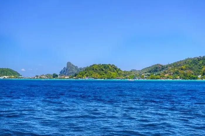 Framed Print : Motor ship in the bay of Ko Phi Phi Don Island with huge rocks and cliffs on a sunny day Framed Print : Motor ship in the bay of Ko Phi Phi Don Island with huge rocks and cliffs on a sunny day
