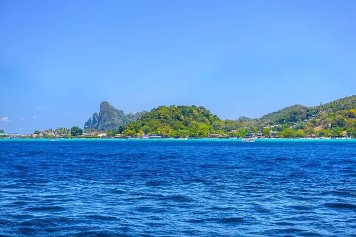 Framed Print : Motor ship in the bay of Ko Phi Phi Don Island with huge rocks and cliffs on a sunny day Framed Print : Motor ship in the bay of Ko Phi Phi Don Island with huge rocks and cliffs on a sunny day