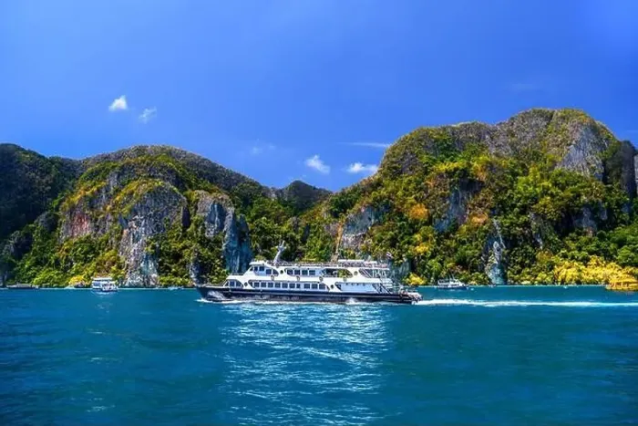 Framed Print : Motor ship in the bay of Ko Phi Phi Don Island with huge rocks and cliffs on a sunny day Framed Print : Motor ship in the bay of Ko Phi Phi Don Island with huge rocks and cliffs on a sunny day