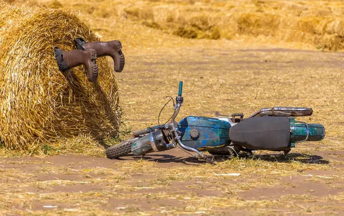 Framed Print : A motorycle near the haystack and boots in the pile of straw. crash humor concept decoration Framed Print : A motorycle near the haystack and boots in the pile of straw. crash humor concept decoration