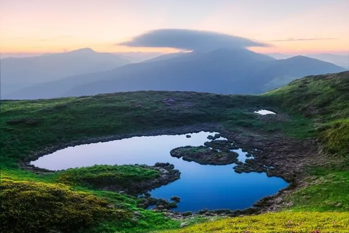 Framed Print : Mountain lake on sunrise time. Picturesque summer landscape with green mountain hills and sun rays in morning sky. Carpathian mountains Framed Print : Mountain lake on sunrise time. Picturesque summer landscape with green mountain hills and sun rays in morning sky. Carpathian mountains