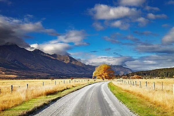 Mountain landscape with road and blue sky, Otago, New Zealand