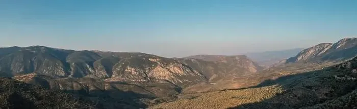Framed Print : Mountain landscape wide panorama aerial drone view. Greece, Boeotia, Parnassos mountain, olive trees grove and blue sky Framed Print : Mountain landscape wide panorama aerial drone view. Greece, Boeotia, Parnassos mountain, olive trees grove and blue sky