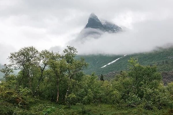 Mountain peak in fog in Innerdalen