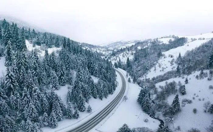 Framed Print : Mountain road forest winter view from drone Framed Print : Mountain road forest winter view from drone