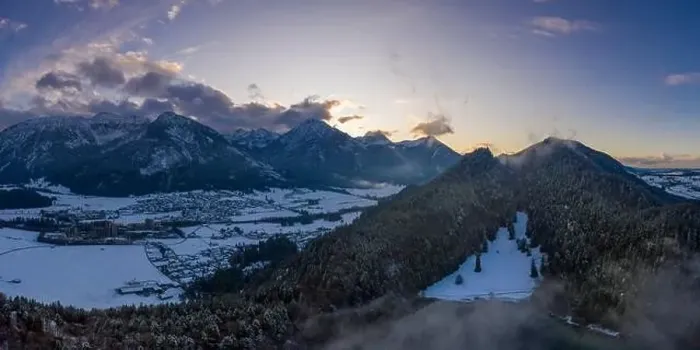 Framed Print : mountain vilsegg and vils city at lake alatsee at snowy winter while sunset sky Framed Print : mountain vilsegg and vils city at lake alatsee at snowy winter while sunset sky