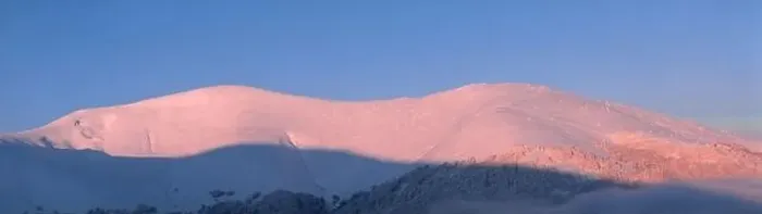 Framed Print : Mountain winter landscape. Colored dawn over the snow-capped mountains. Drone view Framed Print : Mountain winter landscape. Colored dawn over the snow-capped mountains. Drone view
