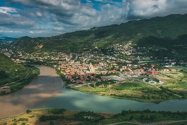 Mtskheta Georgia. Aerial View Of Picturesque Highlands With Blue Sky Over Ancient Town In Green Valley Of Confluence Of Two Rivers