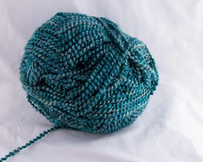Framed Print : Multi Blue tones of spiral twisted yarn ball with strand leading to left Framed Print : Multi Blue tones of spiral twisted yarn ball with strand leading to left