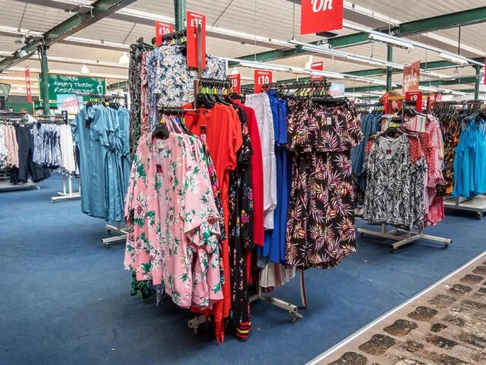 Framed Print : Multi shopping experience in the Ladies clothing department at a retail business park Framed Print : Multi shopping experience in the Ladies clothing department at a retail business park