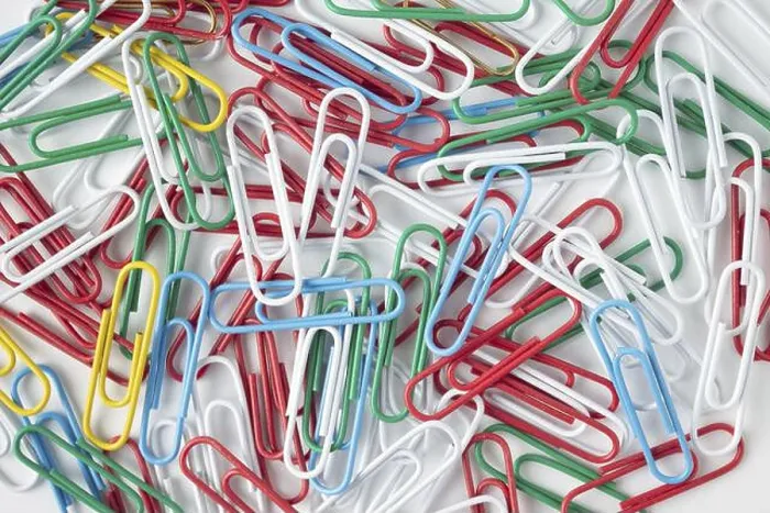 Framed Print : Multicolored paper clips on a white background, texture background Framed Print : Multicolored paper clips on a white background, texture background