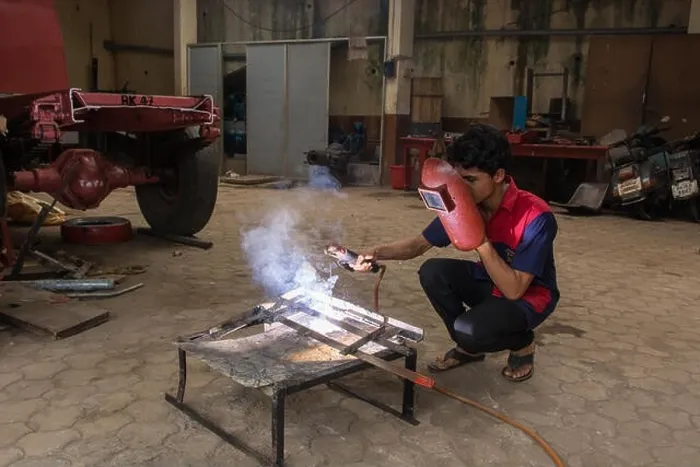 Framed Print : Mumbai, India - July 8, 2018 - Indian boys learning about welding in vocational school Framed Print : Mumbai, India - July 8, 2018 - Indian boys learning about welding in vocational school